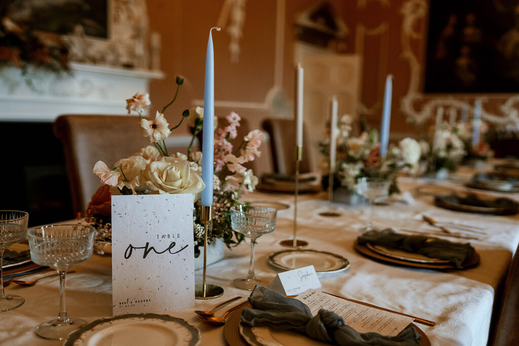 beautiful tablescape f wedding table with flowers and candles from a professional styled photoshoot.